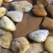 river stones by tamas kanya
