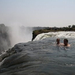 Tourists swimming at Victoria Falls.