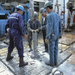 A037-00093 Oil workers on drilling floor of a drilling rig in th