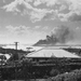 Seen from a distance, the Battleship Arizona burns as it sinks i