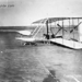 Wilbur Wright in damaged machine after unsuccessful trial, Dec. 