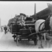 Boy driving horse-drawn wagon loaded with baskets, Hungary 1920-