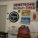 American and Philippine petroliana signs hanging in garage