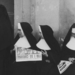 Nuns reading about Pope Pius XII's death.