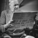 Senator Robert F. Wagner reading a newspaper