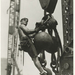 A-worker-riding-on-a-crane-hook-1931-520x727