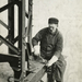 Worker-attaching-a-bolt-onto-a-beam-1931-520x642
