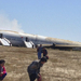 Passengers evacuate the Asiana Airlines Boeing 777, after a cras